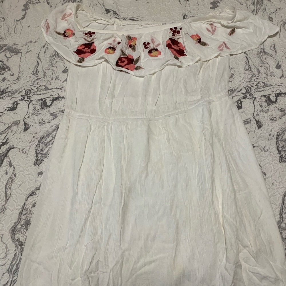 White dress with floral accent